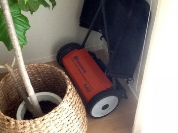 An orange-color lawn mower, Husqvarna NovoLette 540N. A photo in the living room.