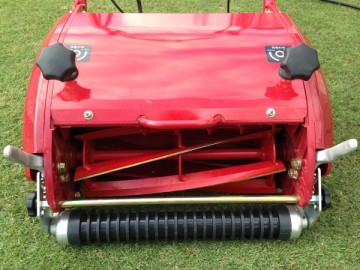 Front side of the mower. A reel type six-blade and a grooved front roller.