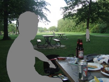 Barbeque in the lawn in Angrignon Park. A can and bottles of beer on the table.