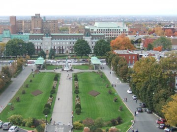 The view from the oratory. Green lawn garden and the city of Côte-des-Neiges.
