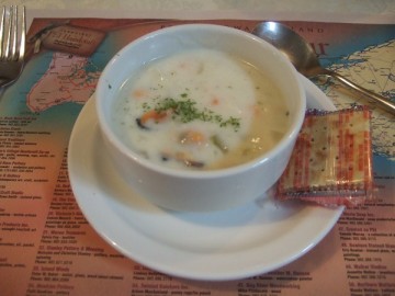 A clam chowder soup on the table.